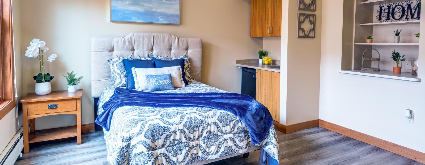 a bedroom with a blue bed