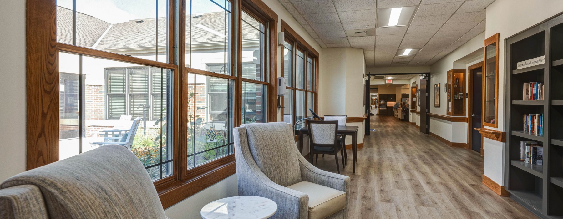 Hallway with comfy couches and bookshelf