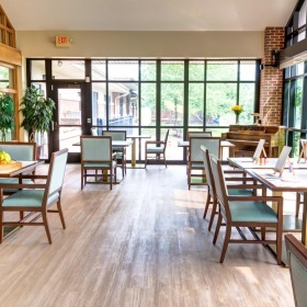 Enjoy our resident-only features a room with tables and chairs