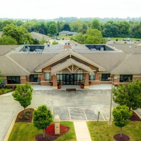Settle into comfort at The Auberge at Oak Village a building with a courtyard and trees